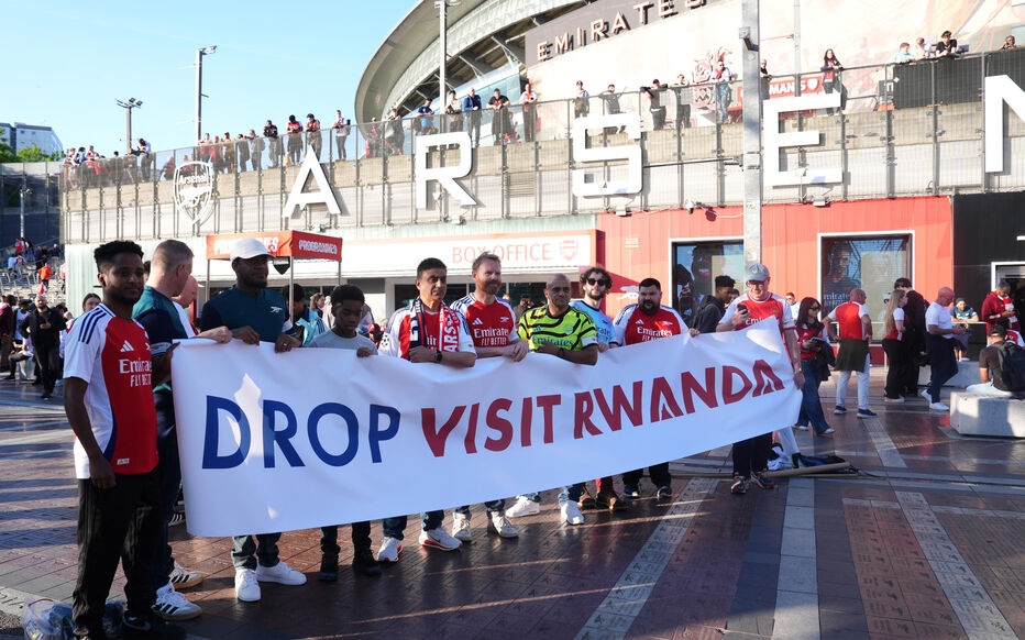 Arsenal fans hold up a banner protesting Visit Rwanda sponsorship ahead of the UEFA Champions League semi final, first leg match at the Emirates Stadium, London. Picture date: Tuesday April 29, 2025.